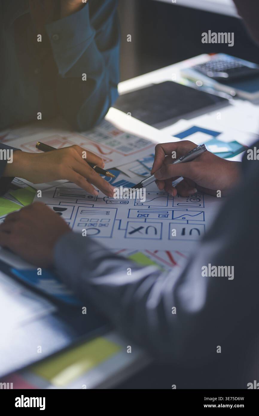 Team of Program Developer Collaborating on UXUI Design Planning in a Modern Office Environment Stock Photo