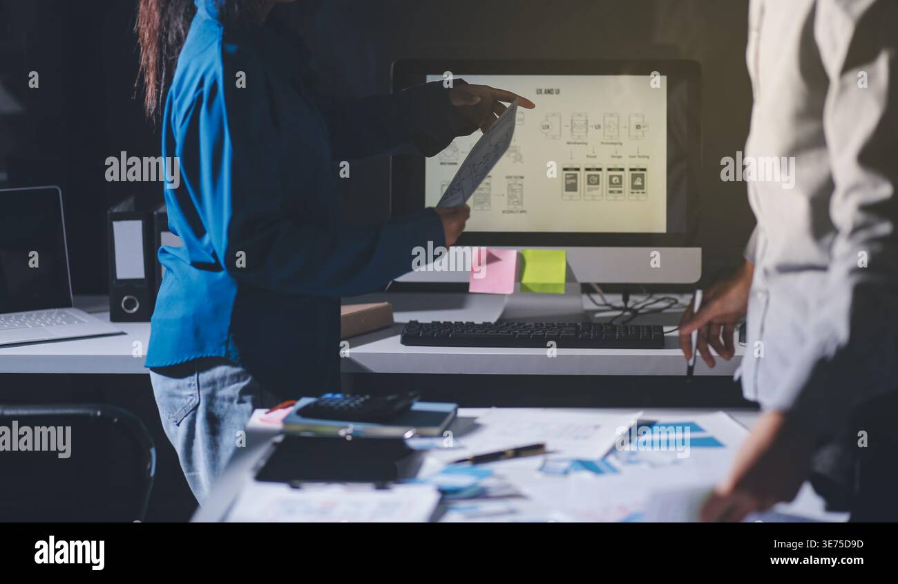 Team of Program Developer Collaborating on UXUI Design Planning in a Modern Office Environment Stock Photo