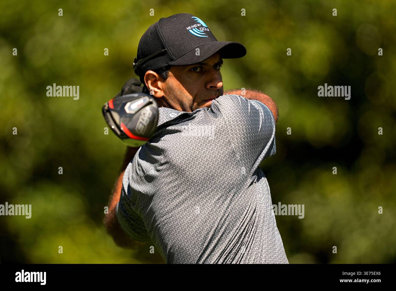 Aaron Rai, of England, watches his tee shot on the 11th hole during the ...
