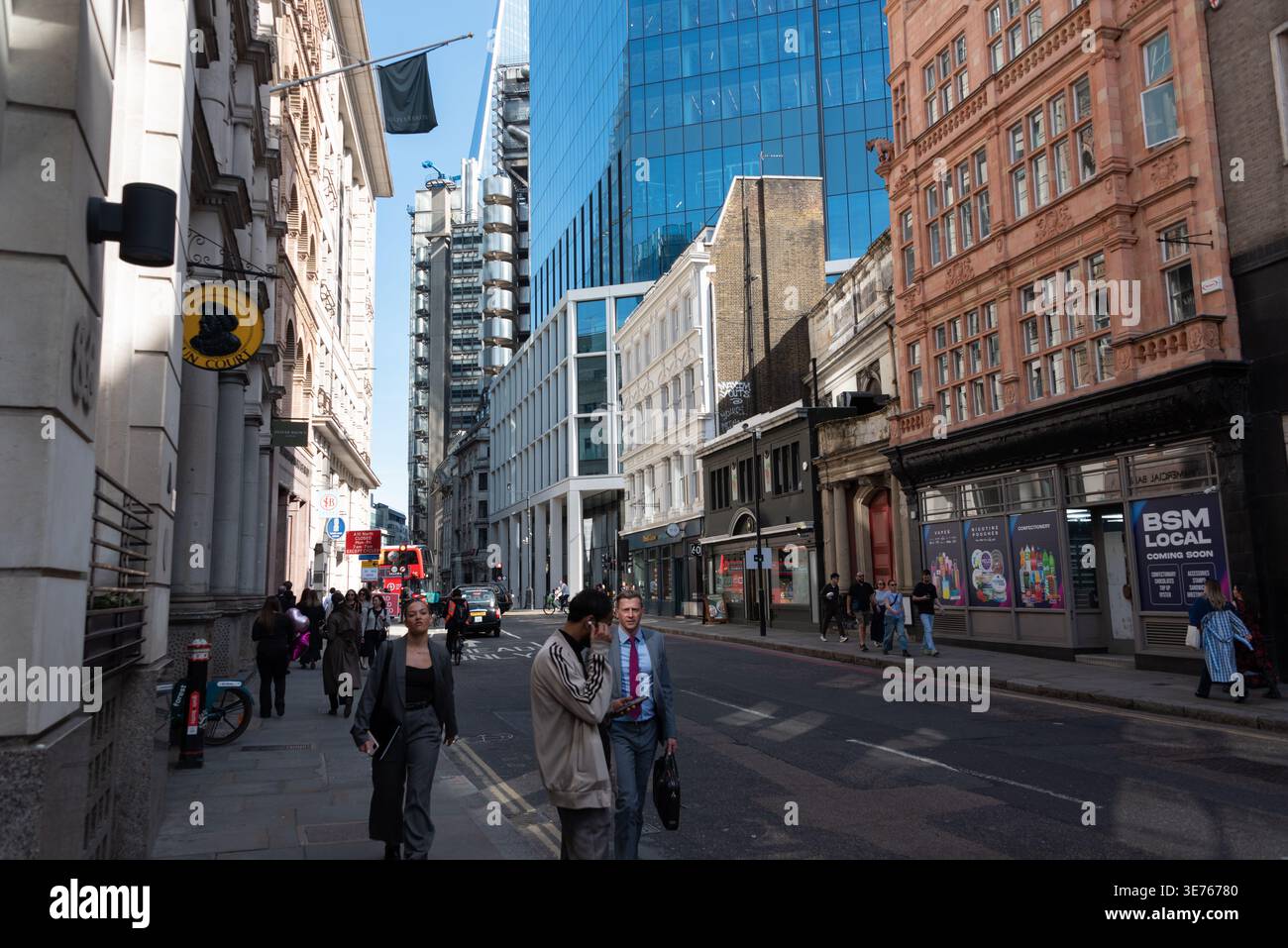 London street scene in financial district with modern building and workers Stock Photo