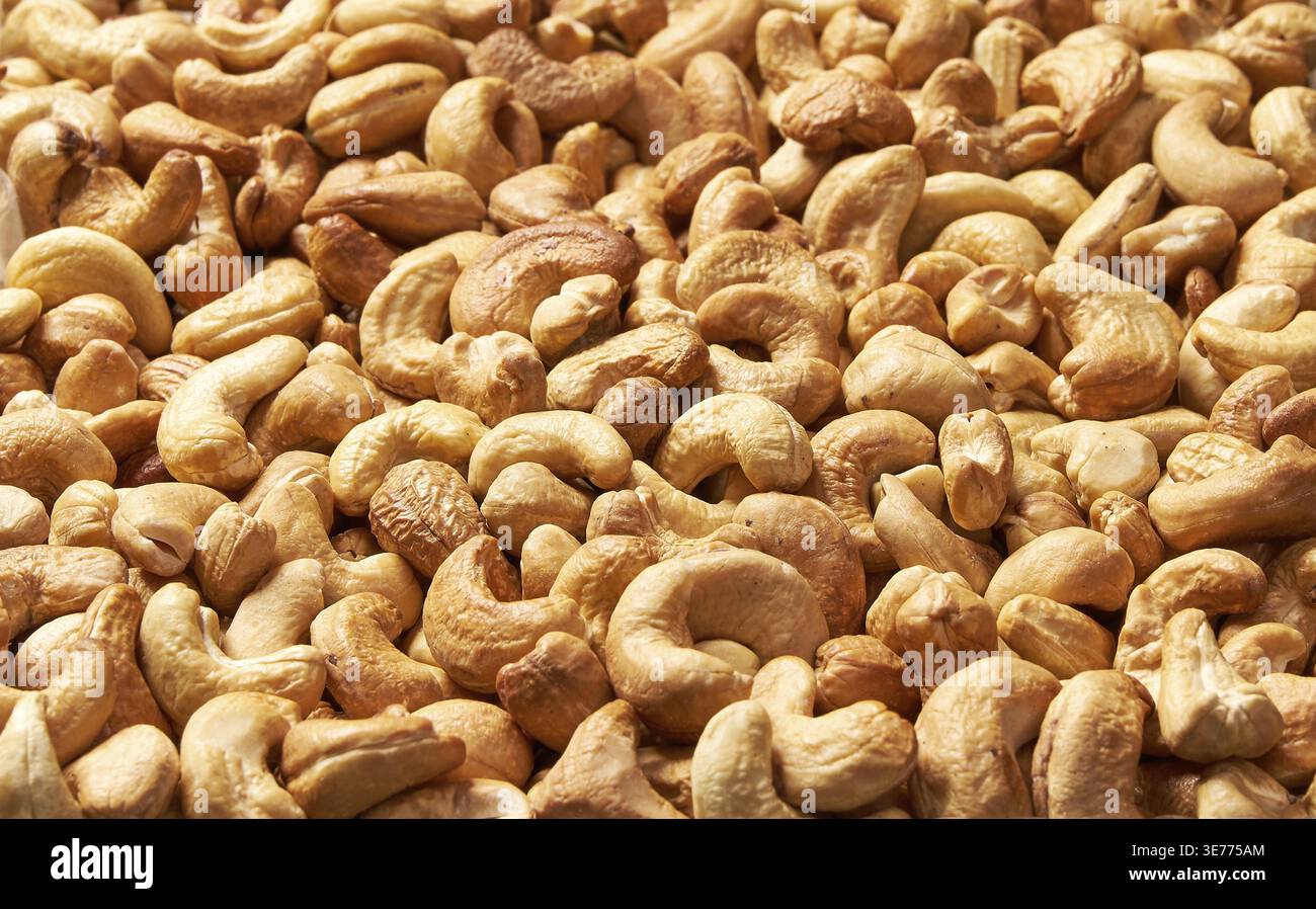 Roasted cashew nuts, texture and background. Tasty cashew nuts as background, cashew nuts texture. lay flat Stock Photo