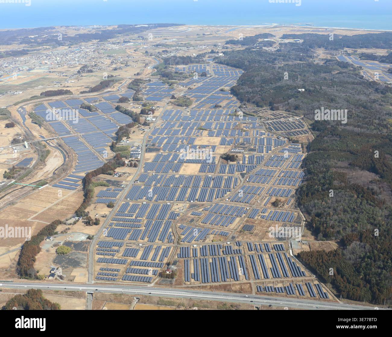 An aerial photo shows the Yatsuda Mega Solar Power Plant installed on a ...