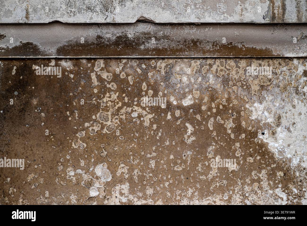 Weathered stone wall texture on London building Stock Photo
