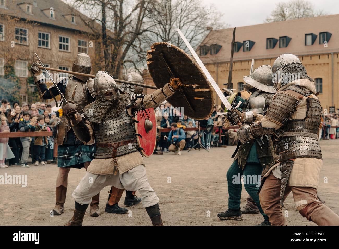 Berlin, Germany - April 5, 2026: armored reenactors battle with shields ...