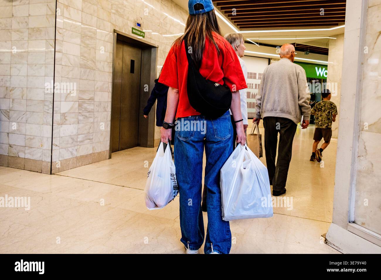 Wearing red top and blue jeans hi-res stock photography and images - Alamy