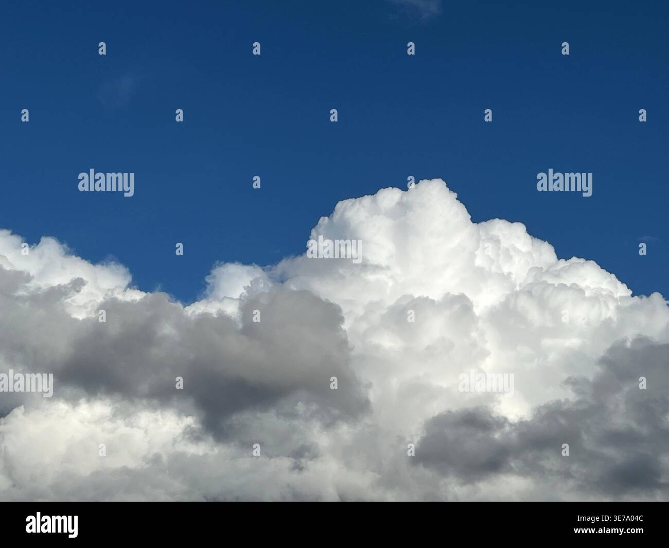 Dramatic cumulus clouds against a blue sky Stock Photo