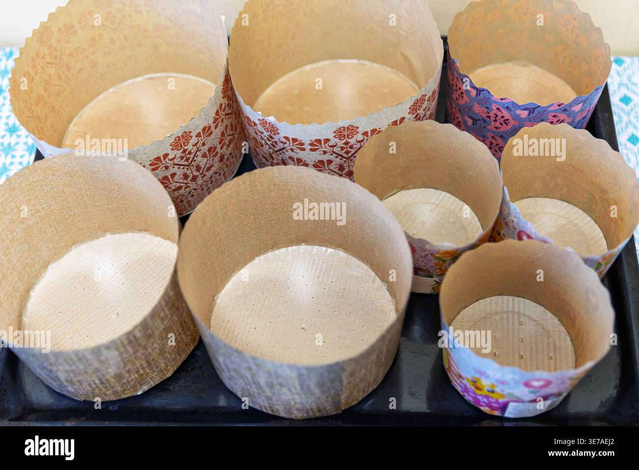 Paper Baking Molds for Easter Paska Bread on a Tray Stock Photo