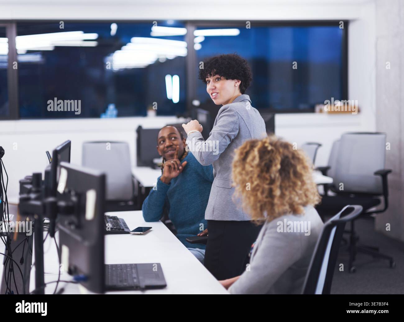 Diverse workmates having fun while working together in office Stock Photo