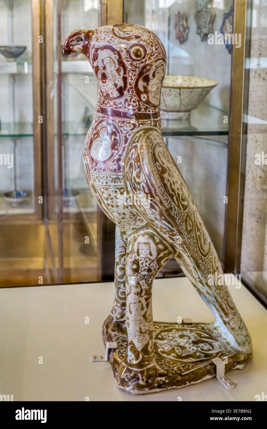 Hawk figurine.  Moulded fritware or stone-paste with an opaque white glaze, painted in lustre. From Iran, probably Kashan. Late C12th or early C13th. Stock Photo