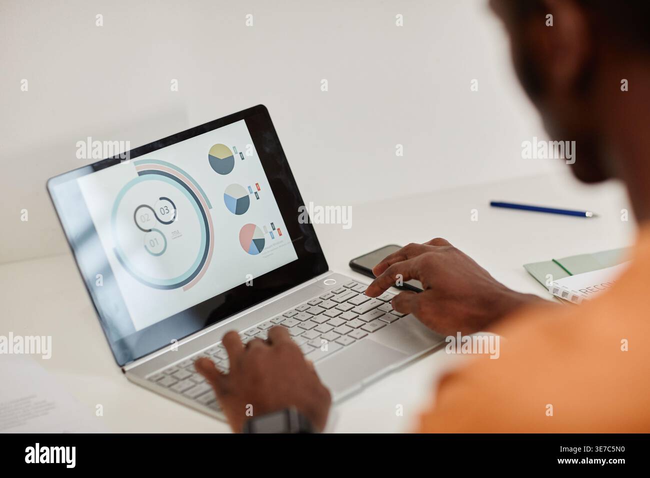 Black man working on laptop at the table in the office Stock Photo