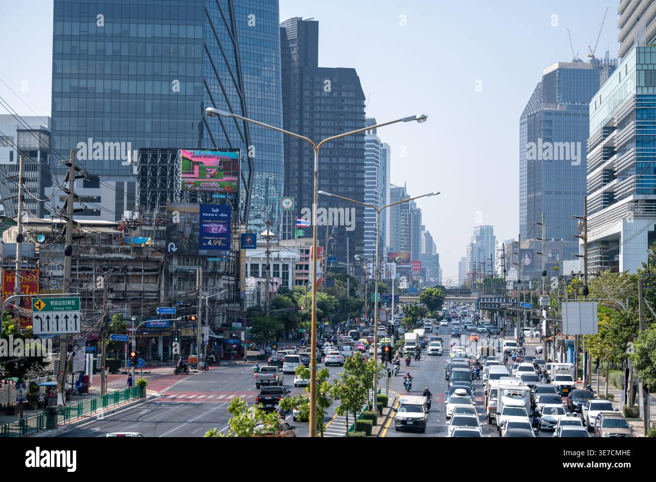 Bangkok Thailand January 16 2026. Urban traffic corridor with dense buildings and multilane traffic near Khlong Toei Market. Stock Photo