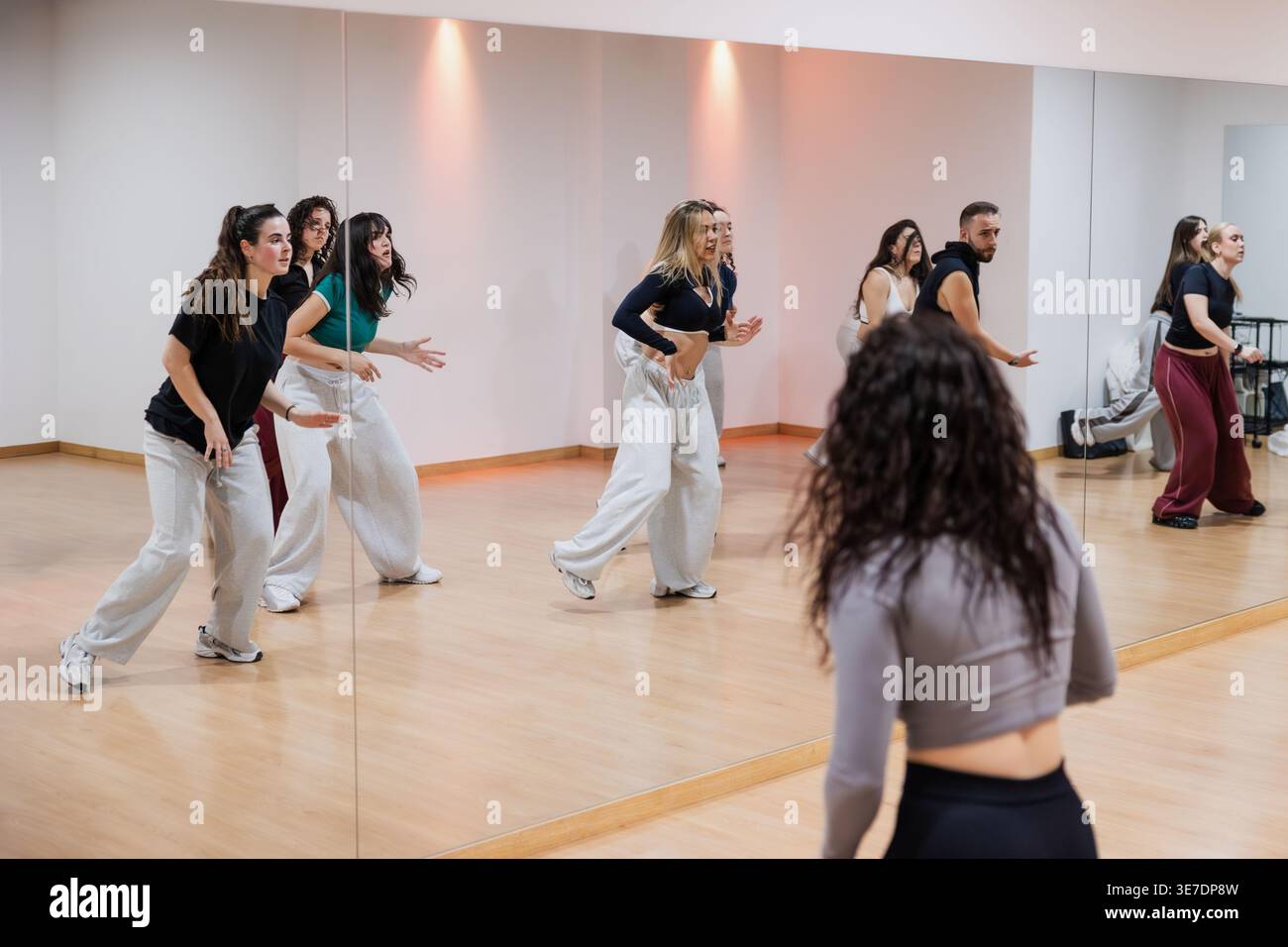 Group of dancers rehearsing choreography in studio Stock Photo