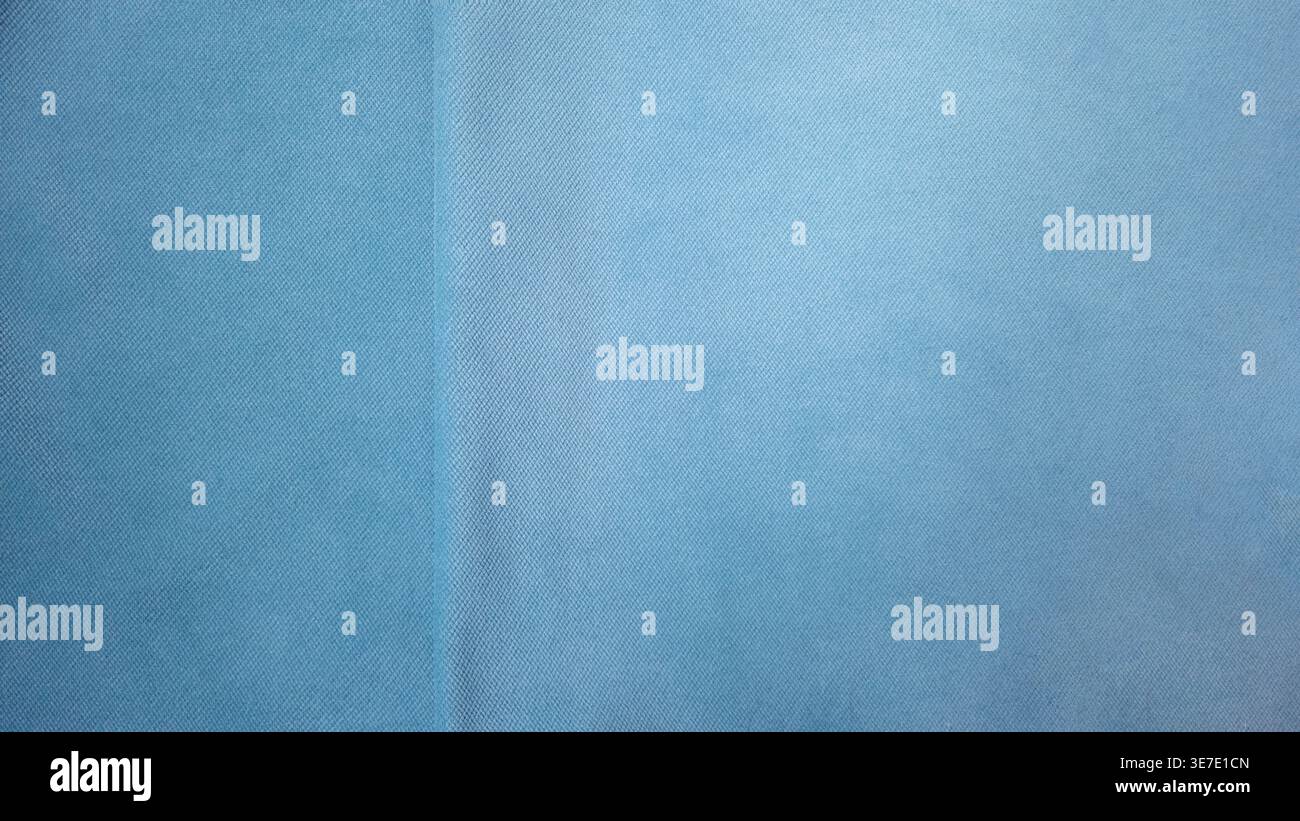 Minimal light blue fabric texture background with soft textile structure and subtle seam detail. Clean abstract backdrop suitable for design, branding Stock Photo
