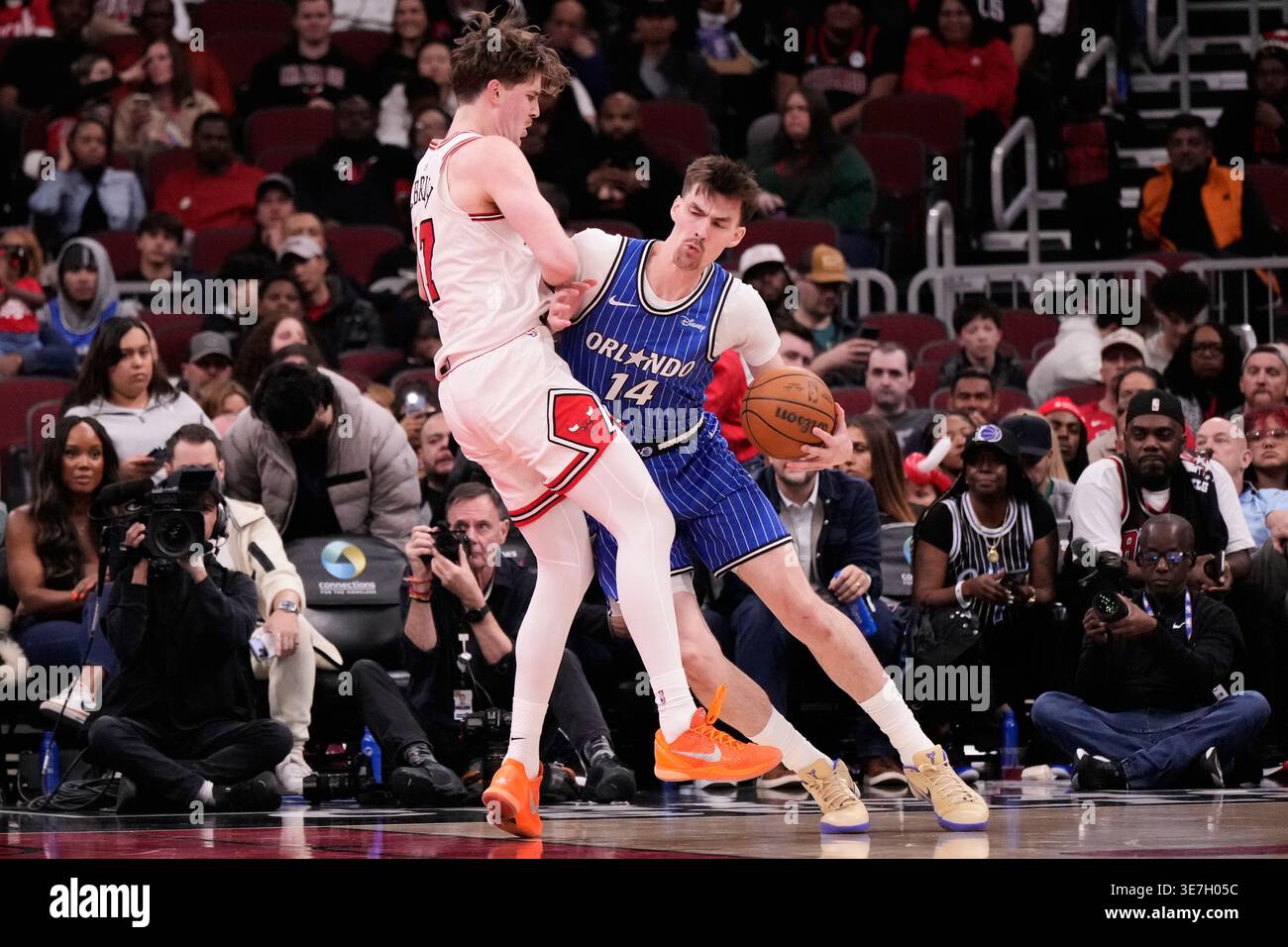 Orlando Magic center Colin Castleton, right, drives against Chicago ...