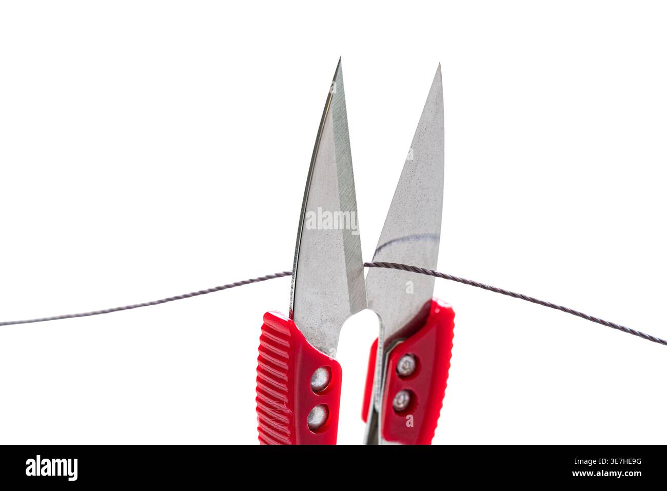 sewing scissors cutting thread on white isolated background Stock Photo