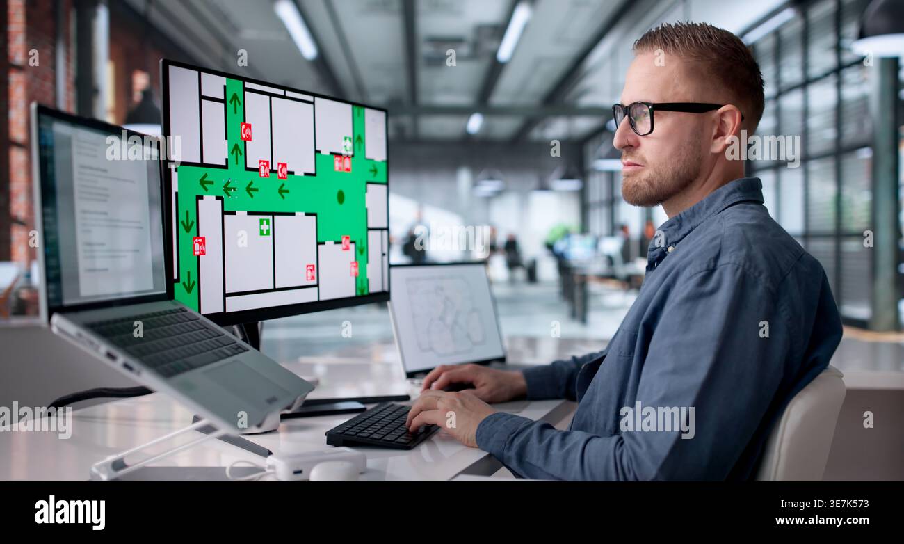 Office Fire Safety Inspector Verifying Alarm Function For Evacuation Readiness Stock Photo