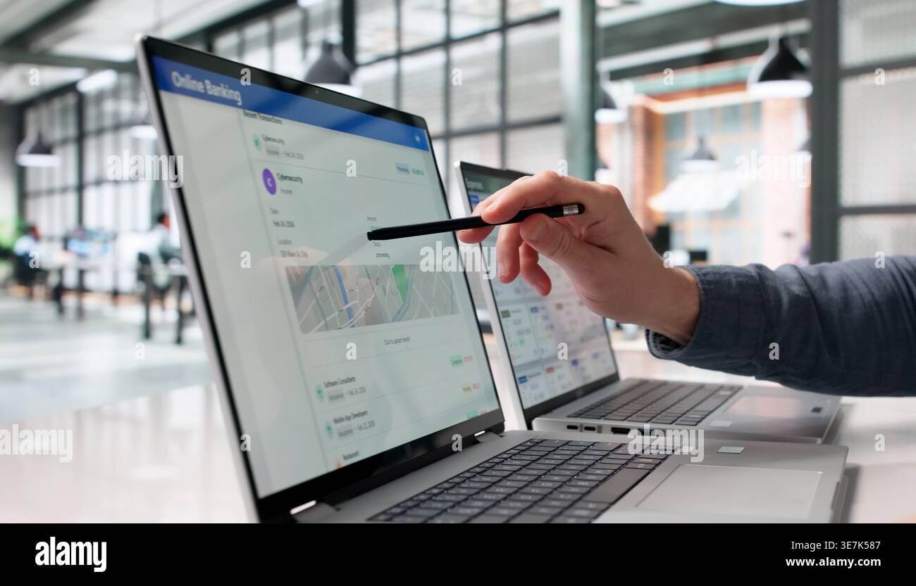 Man Verifying Bank Transfer Information On Laptop Display Stock Photo