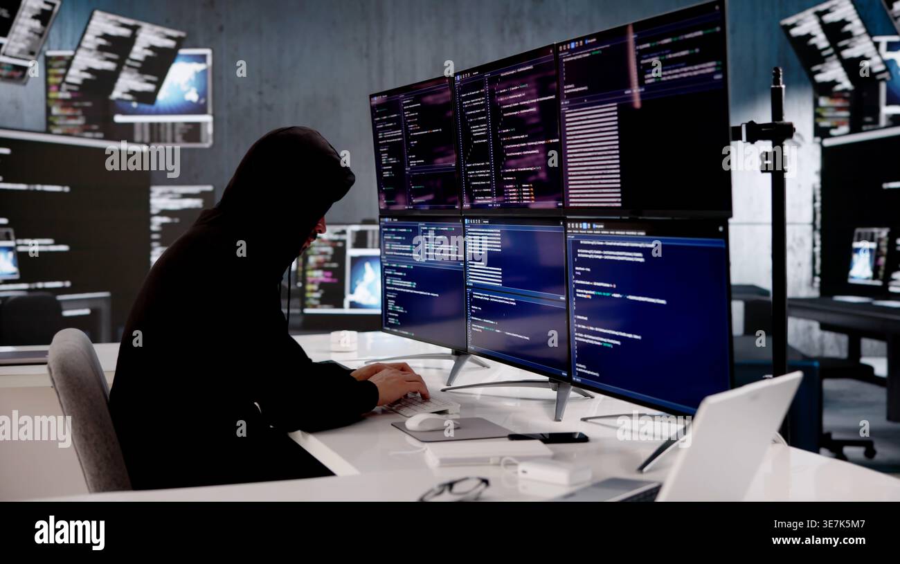 Young Hispanic Programmer Swiftly Typing On Laptop, Breaking Through Cybersecurity Defenses Stock Photo