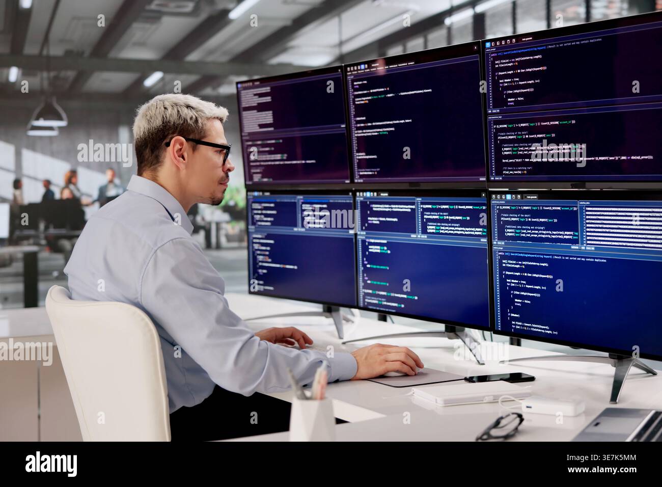 Hispanic Software Engineer Concentrating On Building Innovative Web Apps At His Workspace Stock Photo