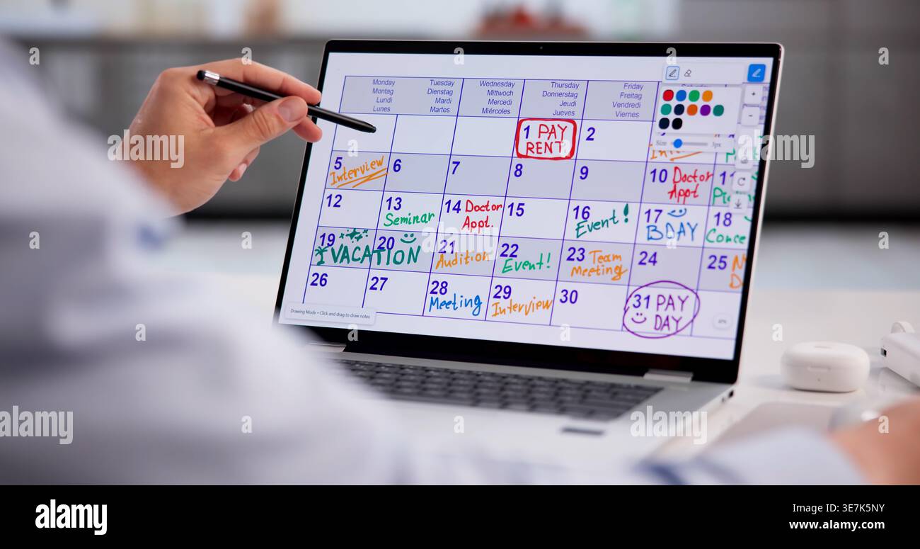 Hispanic Businessman Scheduling Tasks And Taking Notes On Laptop For Project Planning Stock Photo