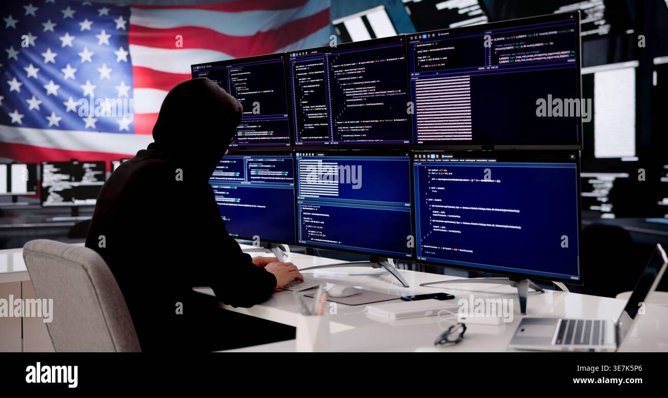Cybersecurity Expert Coding Against American Flag Backdrop Stock Photo