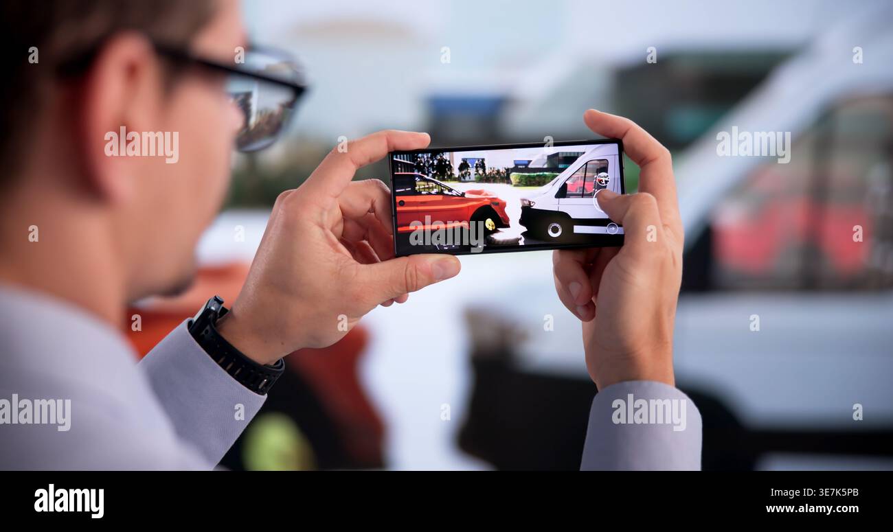 Insurance Agent Examines Vehicle Damage After Crash Using Smartphone Stock Photo