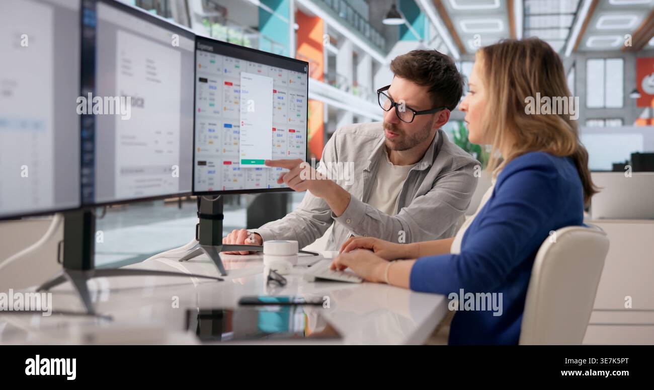 Archivist Systematically Managing Various Files On Computer For Cloud-Based Organization Stock Photo