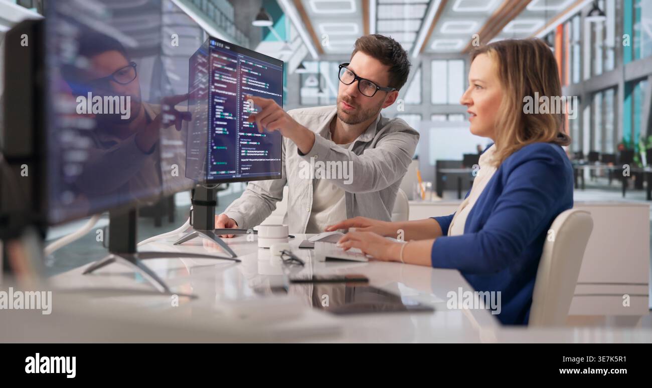 Tech Professional Collaborates On Programming To Create Innovative Solutions Stock Photo