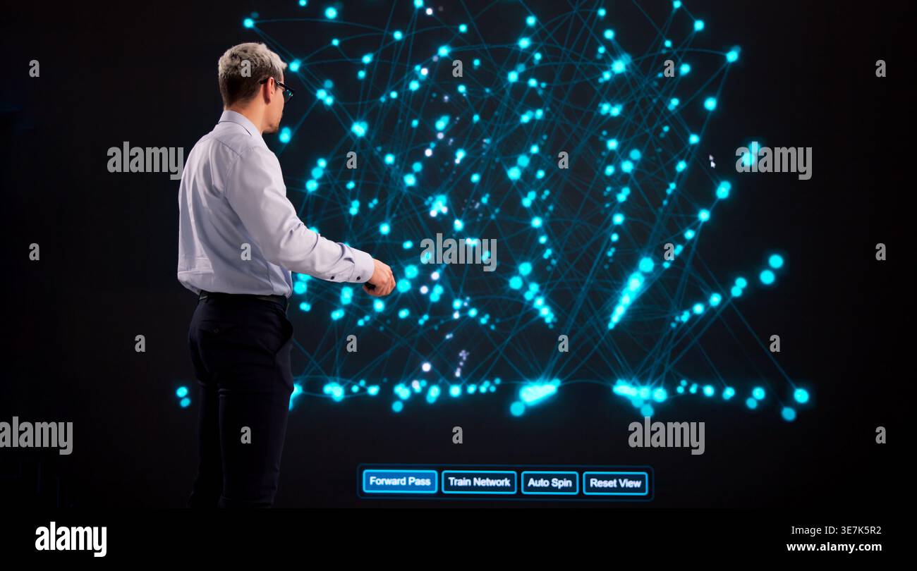 AI Training Supervision By Software Engineer On Interactive Display In Modern Office Environment Stock Photo