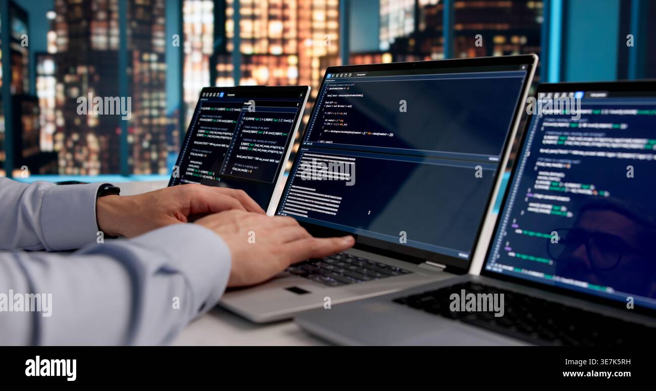 Dedicated Software Developer Immersed In Coding Web Applications At Office Desk Stock Photo