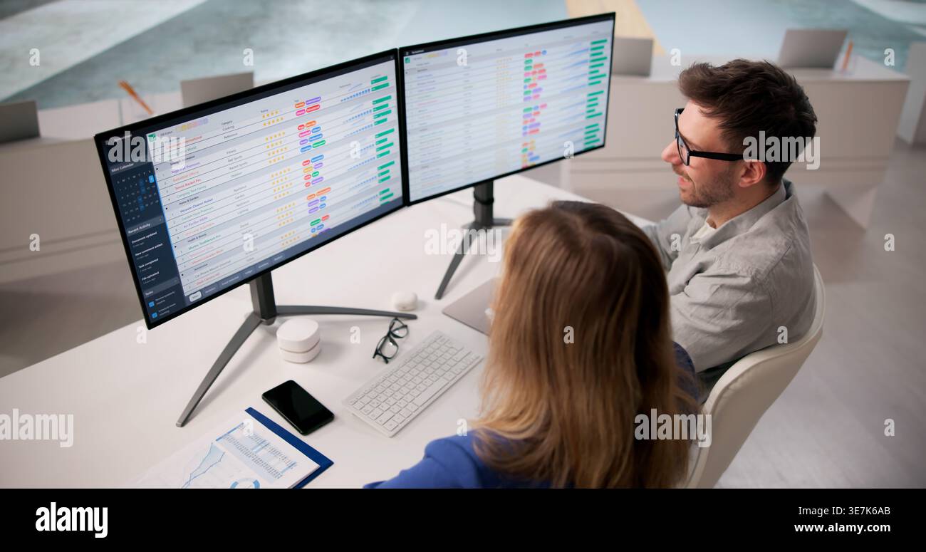 Analyzing Healthcare Data On Computers In A Training Workshop Stock Photo