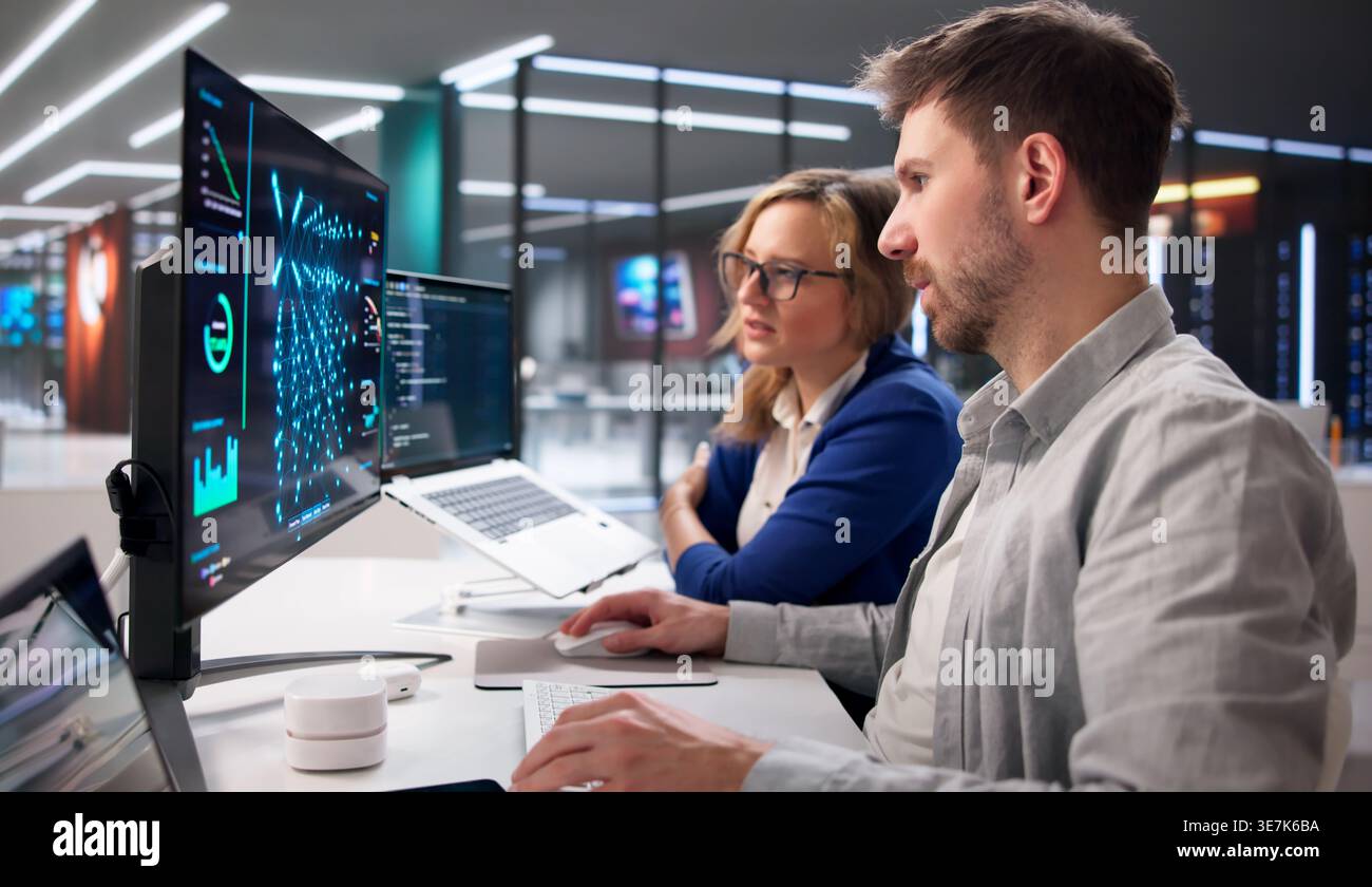 AI Specialist Supervises Machine Learning Inference On Cloud Servers In Data Center Environment Stock Photo