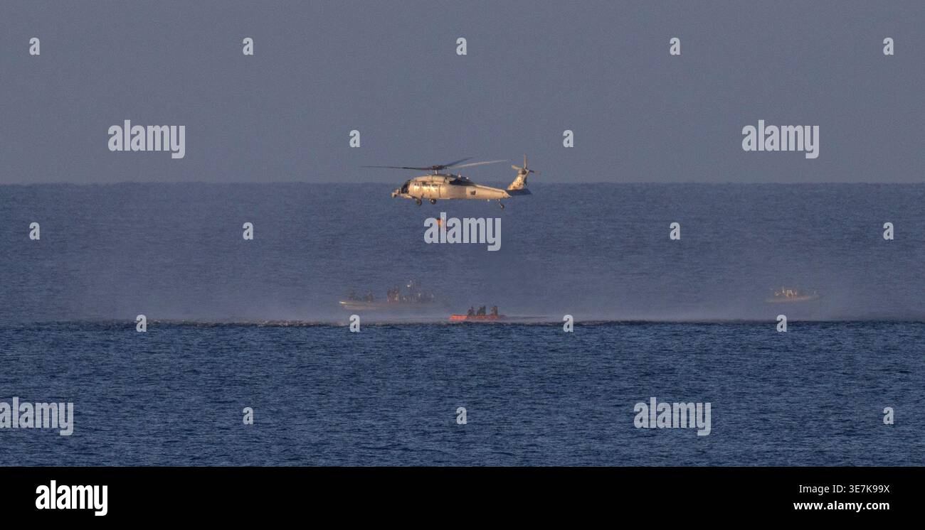 A Navy MH-60 Seahawk from Helicopter Sea Combat Squadron (HSC) 23 is ...