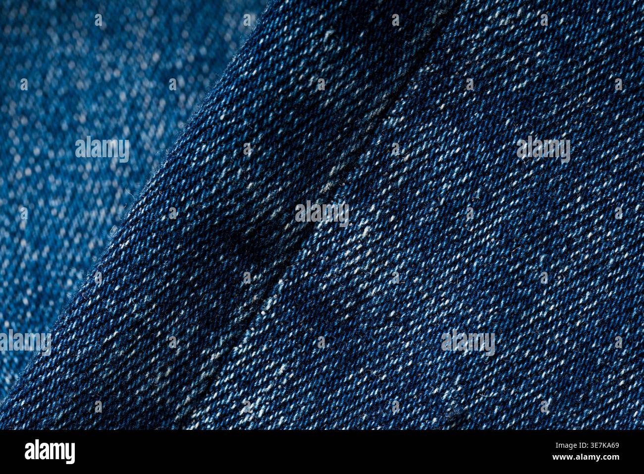 Detailed blue denim fabric texture background with visible stitching pattern Stock Photo