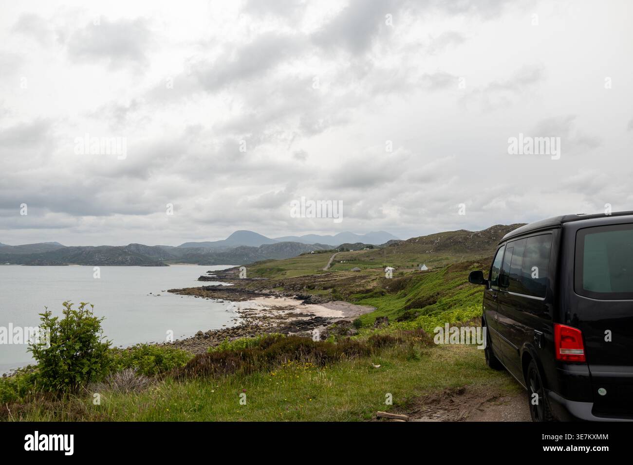A VW California camper van parked on a coastal road in the Scottish ...