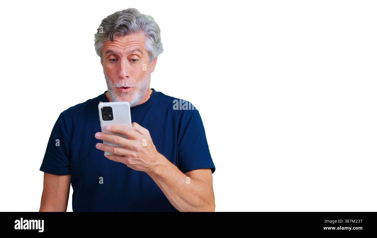 Senior man showing surprise using a smartphone Stock Photo