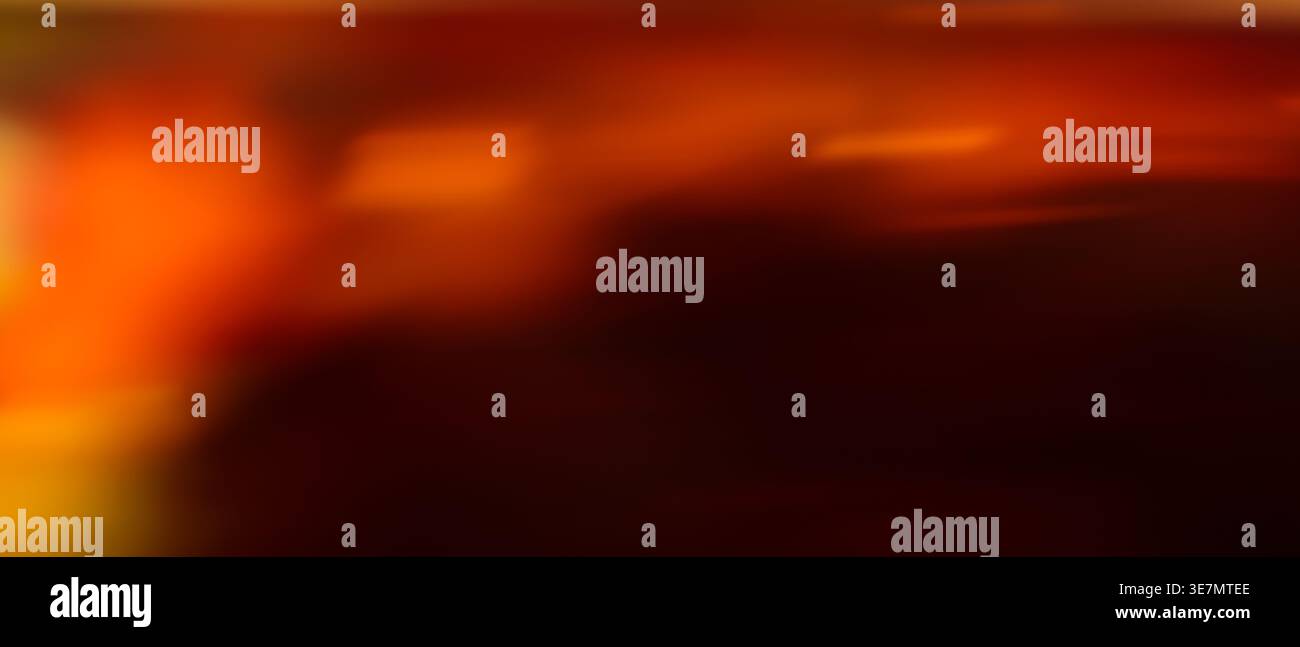 Dark red and orange dramatic abstract blurred gradient background with fiery warm tones and copy space Stock Photo