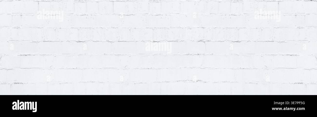 White painted concrete block wall. Whitewashed old brick texture. Light grunge panoramic background Stock Photo