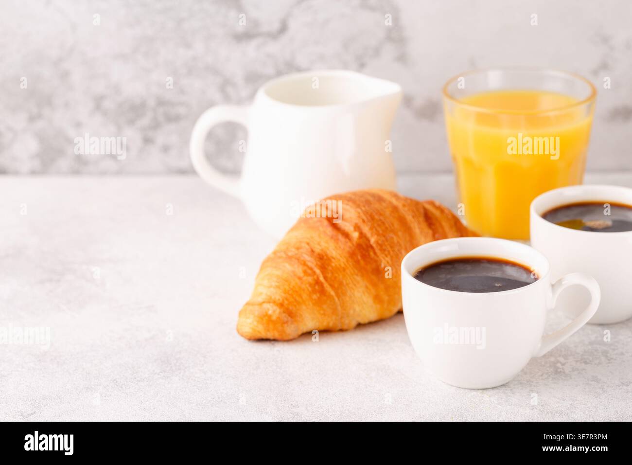 Hot coffee, croissants on a light background, selective focus. Breakfast concept Stock Photo