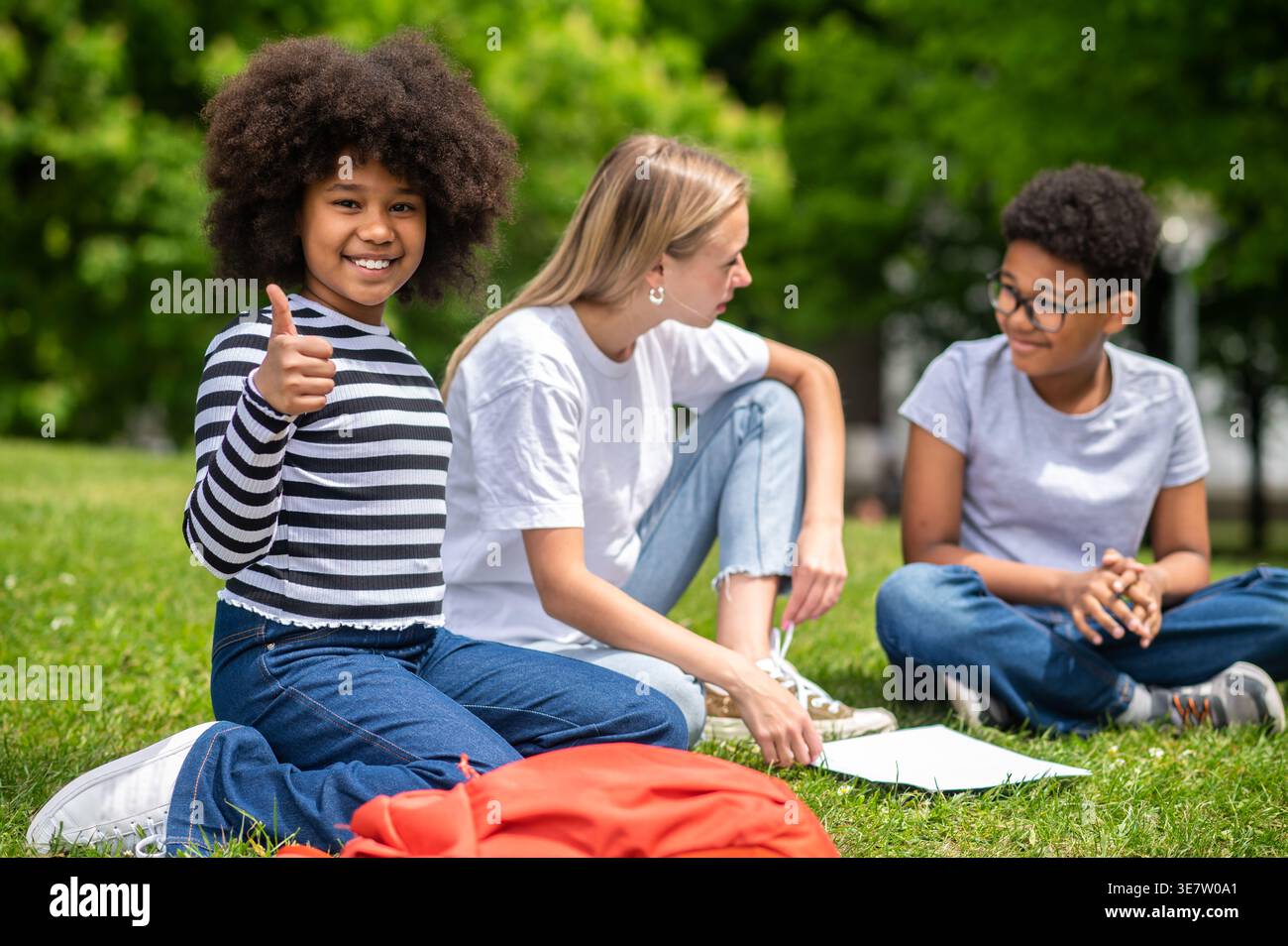 Teen girl showing thumbs hi-res stock photography and images - Alamy