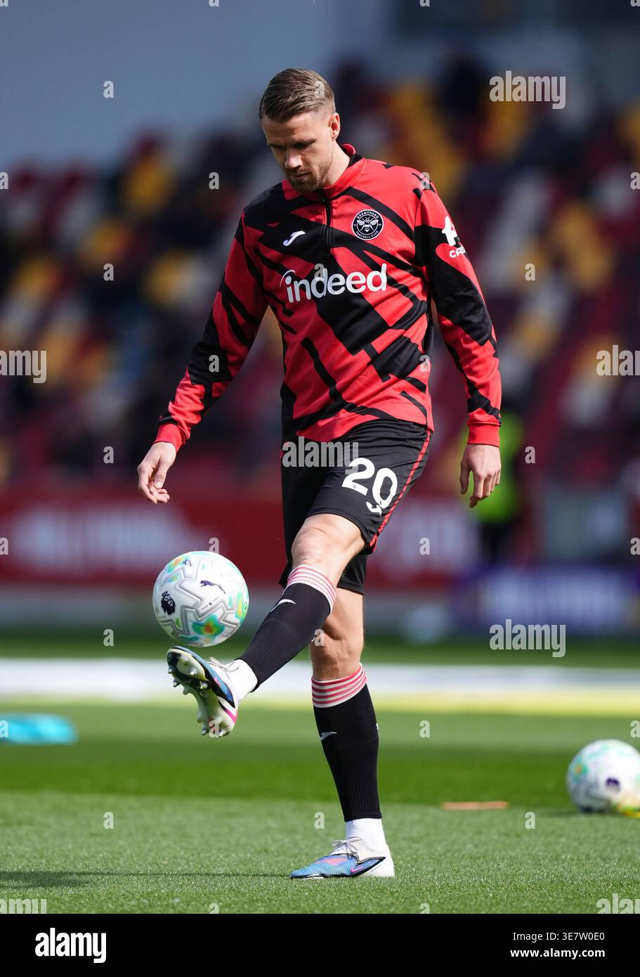 Brentford's Kristoffer Ajer warming up before the Premier League match ...