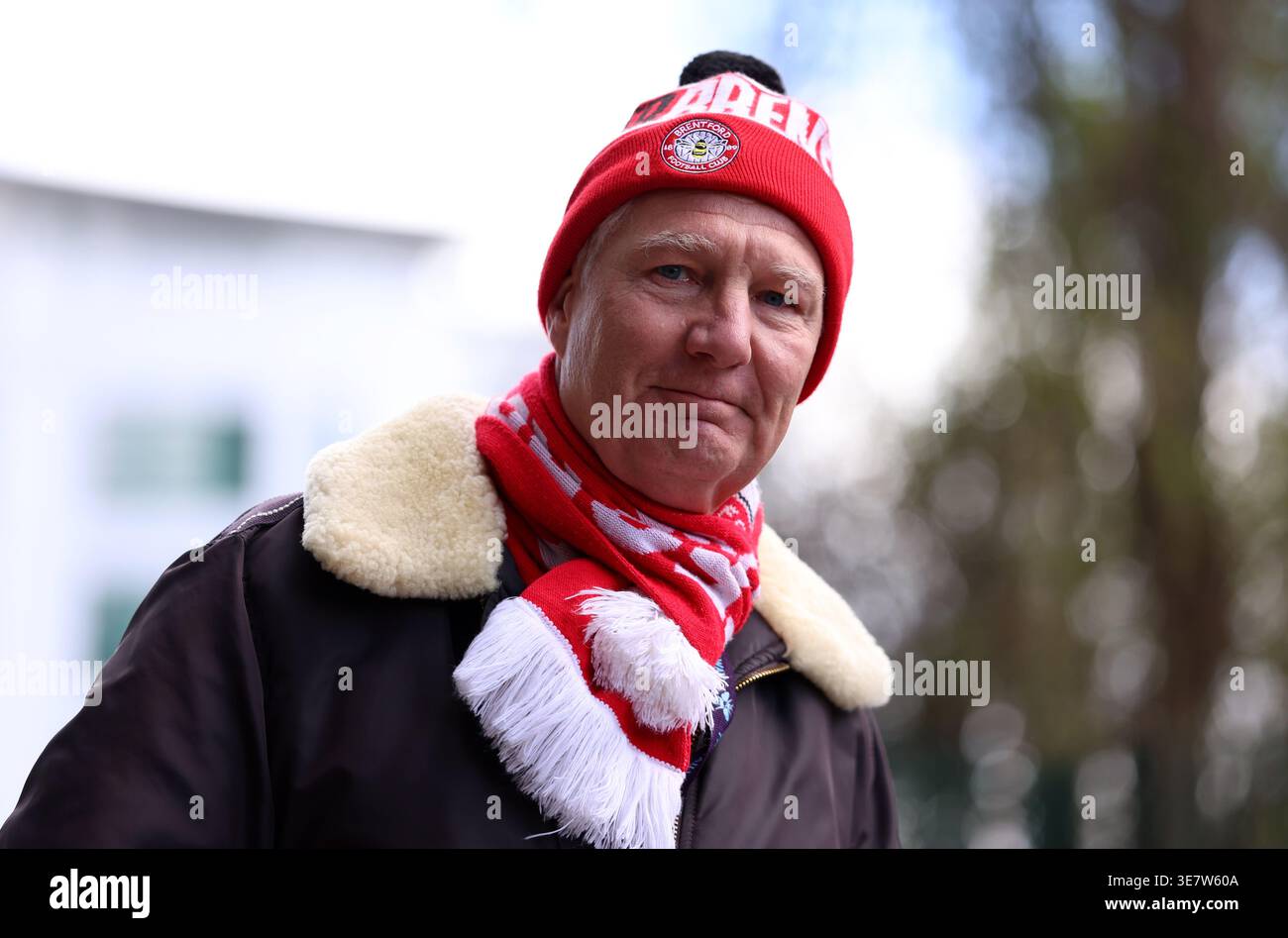 A Brentford fan outside the ground before the Premier League match at ...