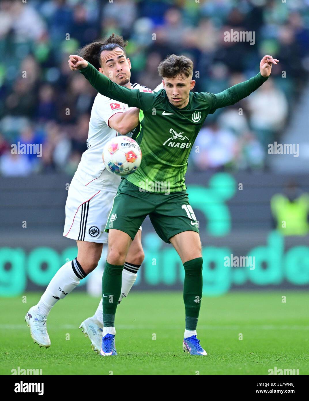 from left: Arthur Theate, Jesper Lindstroem (Wolfsburg) Wolfsburg ...