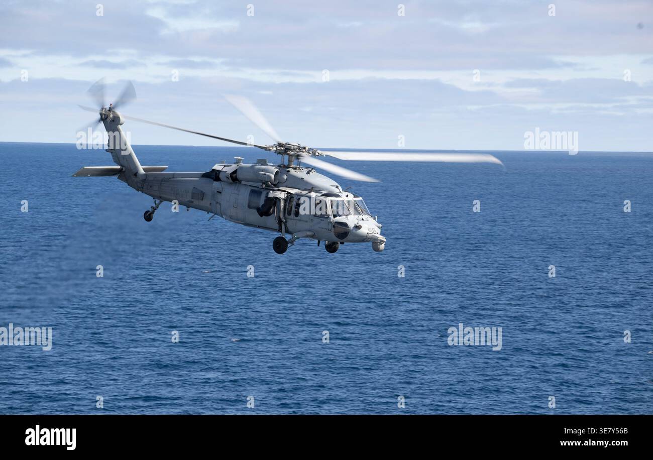 A U.S. Navy MH-60 Seahawk from Helicopter Sea Combat Squadron (HSC) 23 ...