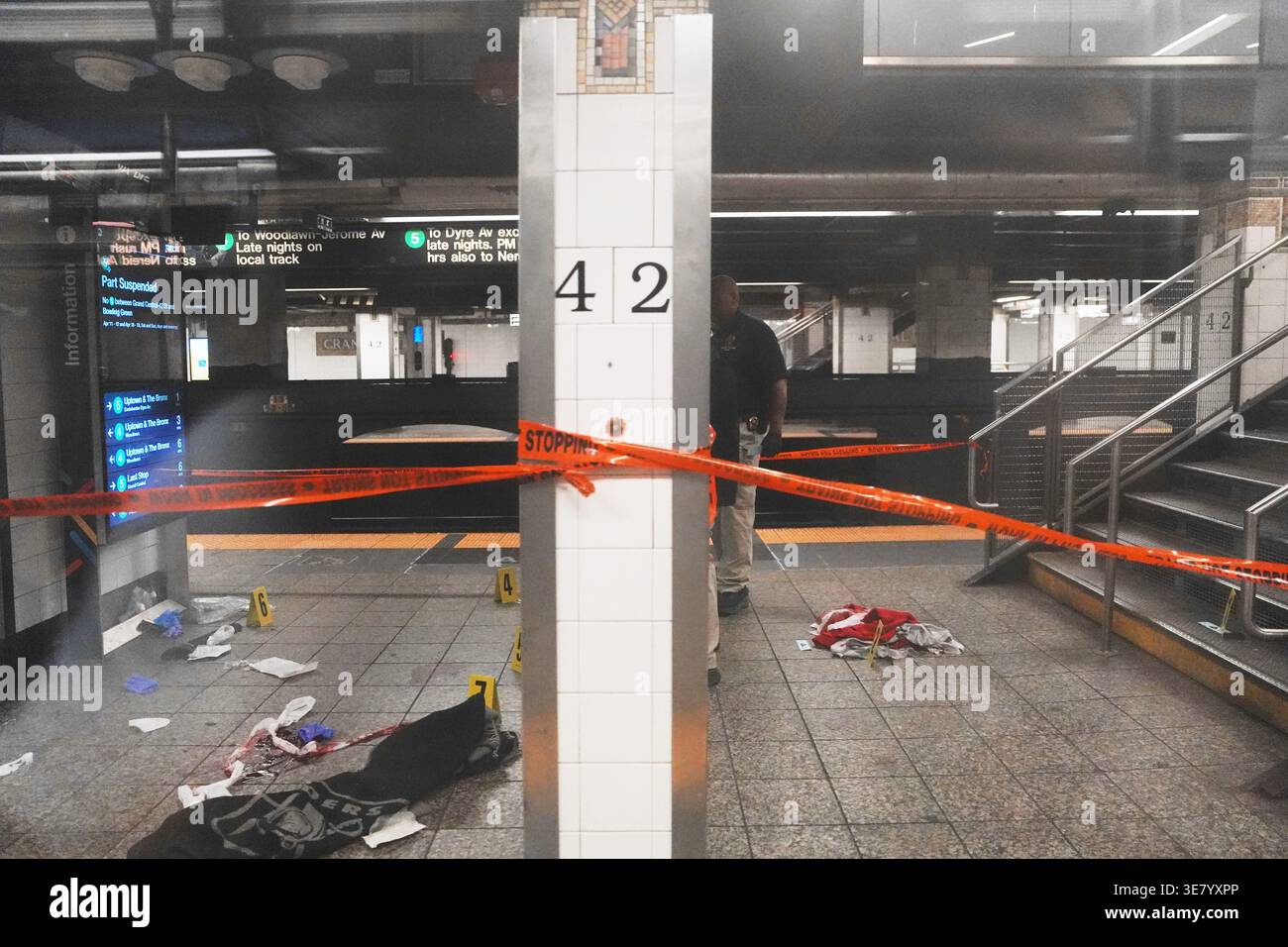 Police investigate the scene after a reported stabbing and shooting at ...