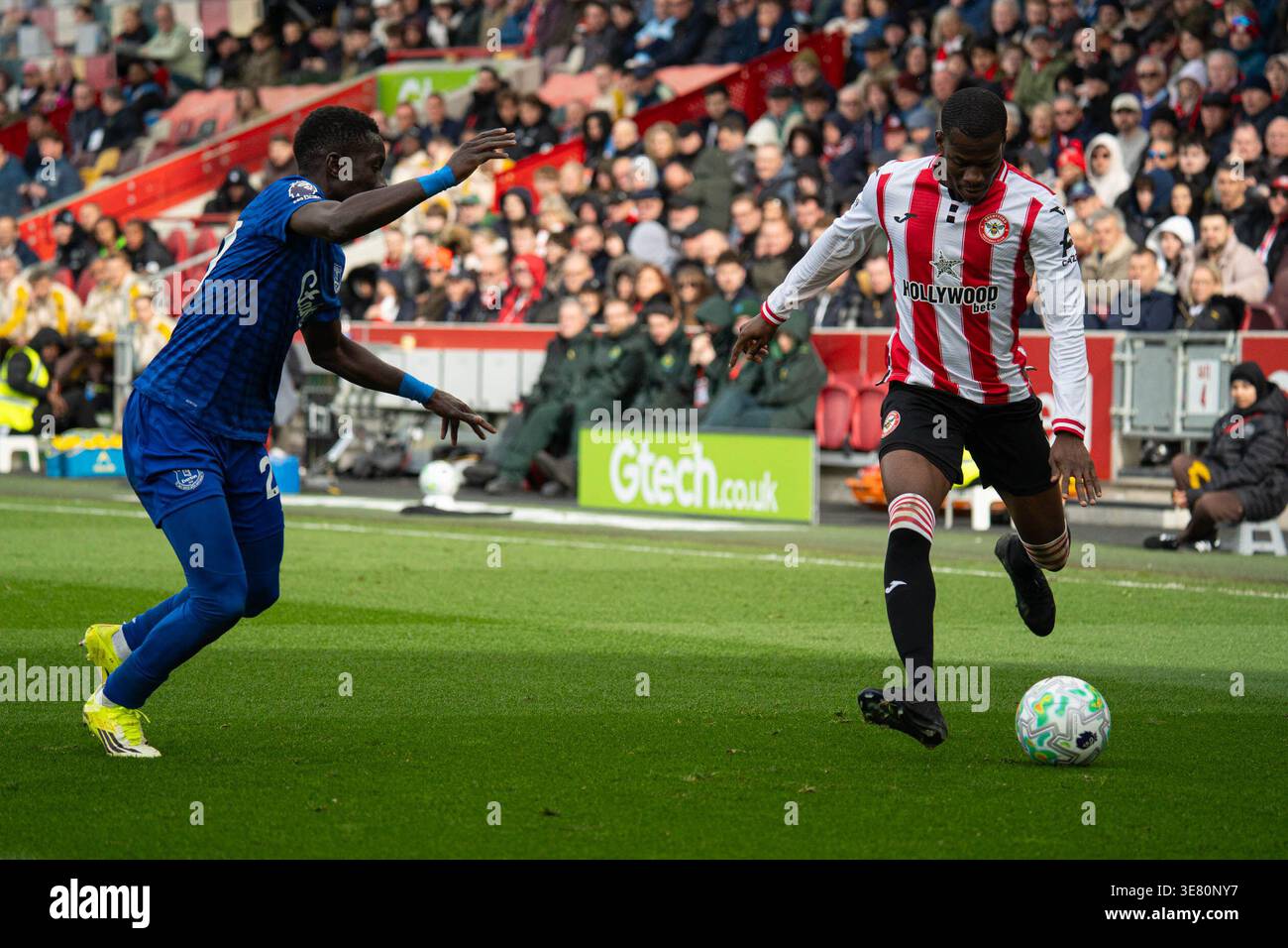 Dango Ouattara crossing the ball into the box during, Brentford v ...