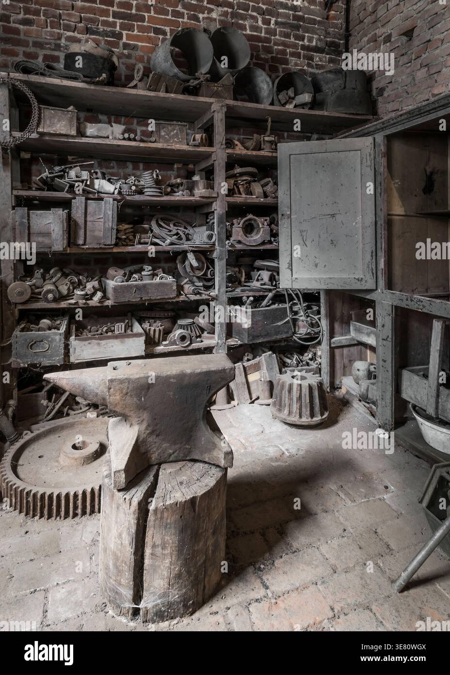 Historic anvil in a abandoned workshop. Stock Photo