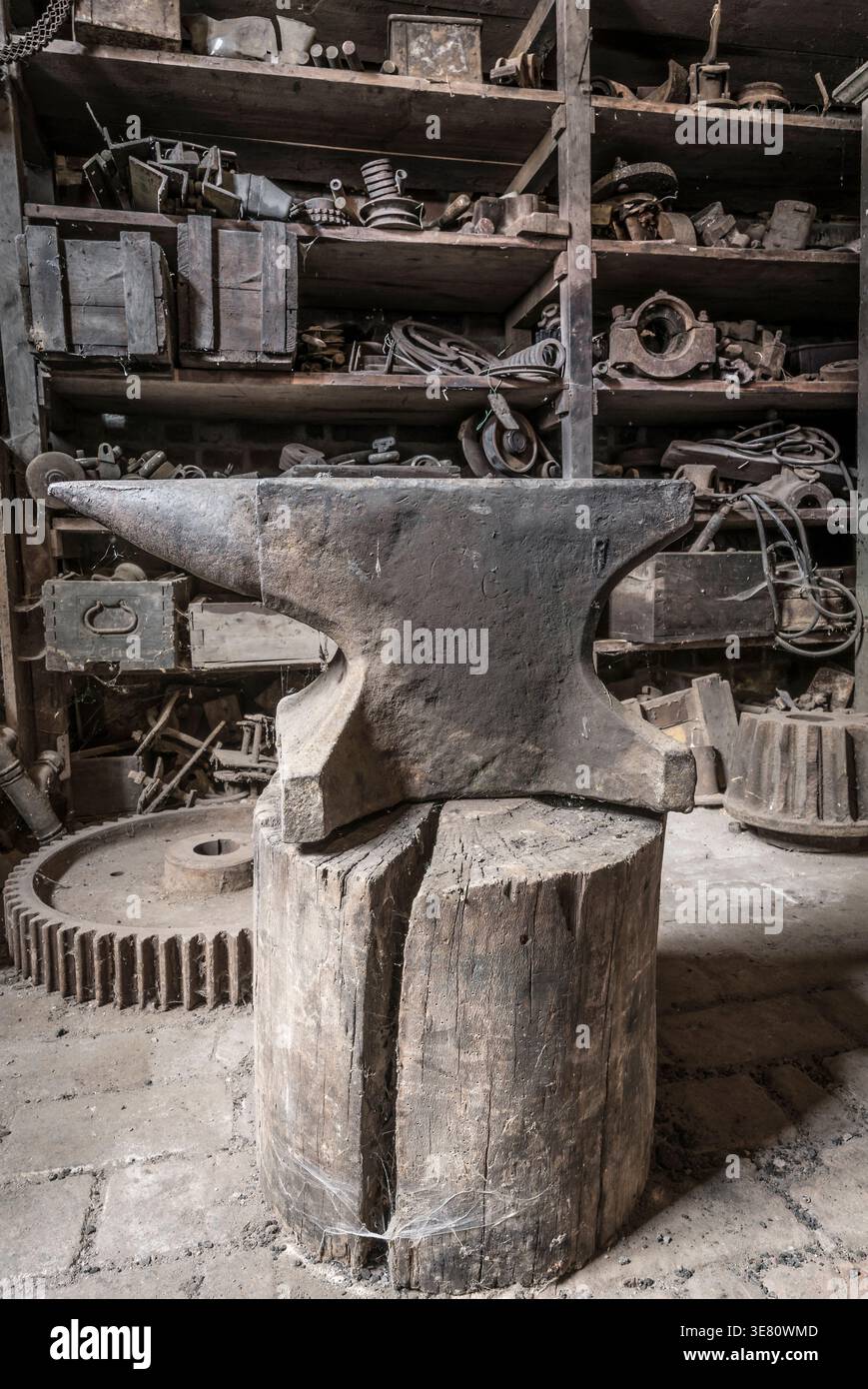 Historic anvil in a abandoned workshop. Stock Photo