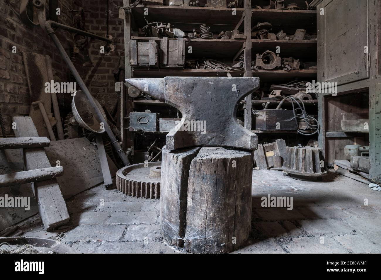 Historic anvil in a abandoned workshop. Stock Photo
