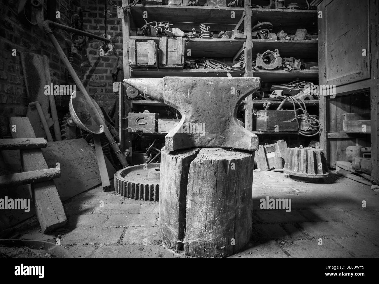 Historic anvil in a abandoned workshop. Stock Photo